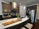 Modern kitchen with stainless steel appliances, white countertops, and pendant lighting at 61 N Auburn Landing Pl, Auburn, GA 30011