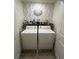 Laundry Room includes a washer, dryer and shelving for storage at 61 N Auburn Landing Pl, Auburn, GA 30011