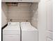 A well lit laundry room with a washer, dryer, and shelving for convenient storage at 821 Ralph Mcgill Ne Blvd # 3337, Atlanta, GA 30306