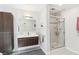 Modern bathroom featuring floating vanity, spacious glass shower, and gray tile flooring at 1244 Arden Sw Dr, Marietta, GA 30008