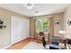 Bedroom with closet, desk, neutral walls and hardwood floor at 1244 Arden Sw Dr, Marietta, GA 30008
