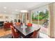 Bright dining room with hardwood floors, modern lighting, and access to the outdoor deck at 1244 Arden Sw Dr, Marietta, GA 30008