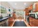 Updated kitchen features stainless steel appliances, wooden cabinetry, and granite countertops at 1244 Arden Sw Dr, Marietta, GA 30008