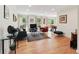Bright living room with hardwood floors, neutral walls, and sliding doors to the outdoor patio at 1244 Arden Sw Dr, Marietta, GA 30008