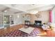 Living room featuring fireplace, hardwood floors, and large windows at 1244 Arden Sw Dr, Marietta, GA 30008