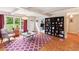 Living room featuring hardwood floors, built-in shelving, and large windows at 1244 Arden Sw Dr, Marietta, GA 30008