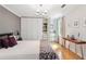 Main bedroom with hardwood floors, neutral colors, and a spacious closet with built-in organizers at 1244 Arden Sw Dr, Marietta, GA 30008