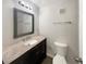 Bathroom featuring vanity with stone countertop, modern fixtures, and neutral paint at 1879 Shamrock Dr, Decatur, GA 30032