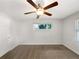 Comfortable bedroom featuring a ceiling fan, neutral color palette, and bright lighting at 1879 Shamrock Dr, Decatur, GA 30032