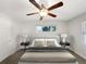 Cozy bedroom featuring a ceiling fan, neutral color palette, and a comfortable atmosphere at 1879 Shamrock Dr, Decatur, GA 30032