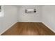Bright bedroom featuring hardwood flooring and natural light from a window at 1879 Shamrock Dr, Decatur, GA 30032