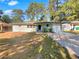 Charming single-story home featuring a freshly painted exterior and a well-maintained front yard at 1879 Shamrock Dr, Decatur, GA 30032