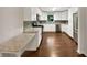 Modern kitchen with white cabinets, stainless steel appliances, and a stylish backsplash at 1879 Shamrock Dr, Decatur, GA 30032