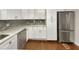 Bright kitchen featuring stainless steel appliances, white cabinets, and lots of countertop space at 1879 Shamrock Dr, Decatur, GA 30032