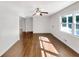 Bright living room featuring hardwood floors, ceiling fan, and natural light at 1879 Shamrock Dr, Decatur, GA 30032