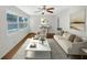 Bright living room boasts large windows, neutral walls, and ample space for relaxation and entertainment at 1879 Shamrock Dr, Decatur, GA 30032