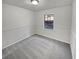 Bedroom with updated walls and neutral carpet and one window at 4425 Amy Rd, Snellville, GA 30039