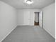 Spacious carpeted bedroom with white walls, lots of light and closet at 4425 Amy Rd, Snellville, GA 30039