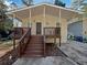 Charming bungalow with covered front porch and inviting stairway at 4425 Amy Rd, Snellville, GA 30039
