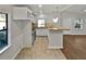 Well lit kitchen featuring white cabinets, tiled backsplash and stainless appliances at 4425 Amy Rd, Snellville, GA 30039