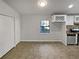 Eat in kitchen featuring white cabinets, stainless appliances, and tiled floors at 4425 Amy Rd, Snellville, GA 30039