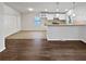 Bright kitchen with white cabinets, a breakfast bar, and modern appliances at 4425 Amy Rd, Snellville, GA 30039