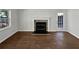 Cozy living room with fireplace, lots of light and hardwood flooring at 4425 Amy Rd, Snellville, GA 30039