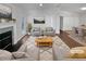 Bright living room with fireplace, ample seating, and hardwood flooring at 4425 Amy Rd, Snellville, GA 30039