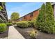 Condo exterior with lush greenery and a brick facade at 5200 Peachtree Rd # 2116, Atlanta, GA 30341