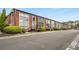 Attractive row of brick townhomes with well-maintained landscaping and private entrances at 5200 Peachtree Rd # 2116, Atlanta, GA 30341