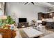 Cozy living room with a large sectional sofa, modern entertainment setup, and an adjacent, well-equipped kitchen area at 5200 Peachtree Rd # 2116, Atlanta, GA 30341
