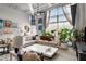 Bright living room featuring a large window, modern decor, stylish seating, and an open, airy atmosphere at 5200 Peachtree Rd # 2116, Atlanta, GA 30341