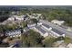 Aerial view showing multiple townhomes in a wooded community at 1494 Addison Pl, Decatur, GA 30033