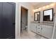 Elegant bathroom featuring a double vanity, granite countertops, and a view to the toilet at 1494 Addison Pl, Decatur, GA 30033