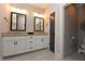 Modern bathroom with double vanity, granite countertop and tiled flooring at 1494 Addison Pl, Decatur, GA 30033