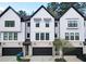 Charming townhome exterior with a two-car garage and modern architecture at 1494 Addison Pl, Decatur, GA 30033