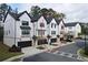 View of the townhome with two-car garage and modern architecture at 1494 Addison Pl, Decatur, GA 30033