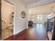 Hallway featuring an open concept floorplan to the dining room, kitchen, and a conveniently located half bath at 1494 Addison Pl, Decatur, GA 30033