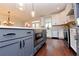 Gourmet kitchen features a center island with seating and stainless steel appliances at 1494 Addison Pl, Decatur, GA 30033