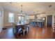 Open concept eat-in kitchen features a large island with bar seating and a stainless steel fridge at 1494 Addison Pl, Decatur, GA 30033