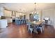 Open concept kitchen with a central island, stainless appliances, and adjacent dining area at 1494 Addison Pl, Decatur, GA 30033
