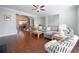 Cozy living room area featuring hardwood floors, a sectional couch, and a view into the eat-in kitchen at 1494 Addison Pl, Decatur, GA 30033