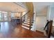 Spacious open floor plan featuring a kitchen and staircase with hardwood floors at 1494 Addison Pl, Decatur, GA 30033