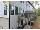 Rear exterior of townhome featuring multiple decks and outdoor areas for entertainment and relaxation at 1494 Addison Pl, Decatur, GA 30033