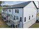 Rear exterior of a townhome with multiple decks, showcasing outdoor living spaces and clean architectural lines at 1494 Addison Pl, Decatur, GA 30033