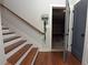 Staircase with hardwood treads and painted risers, showcasing the home's stylish design and easy access to different levels at 1494 Addison Pl, Decatur, GA 30033