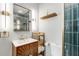 Chic bathroom with modern vanity, bronze hardware, and stylish teal tile shower at 2007 Glenwood Se Ave, Atlanta, GA 30316