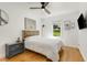 Light filled bedroom with hardwood floors, large bed, and a big window at 2007 Glenwood Se Ave, Atlanta, GA 30316