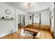 Spacious living room with decorative trim, hardwood floors, and a modern lighting fixture at 2007 Glenwood Se Ave, Atlanta, GA 30316