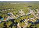 Aerial shot showing home location near neighborhood amenities, roads, and lush tree coverage at 210 Millpond Pkwy, Villa Rica, GA 30180